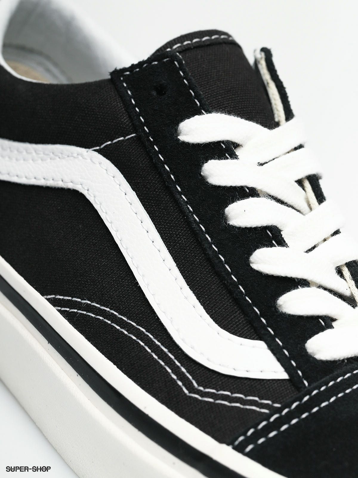 black vans with white trim