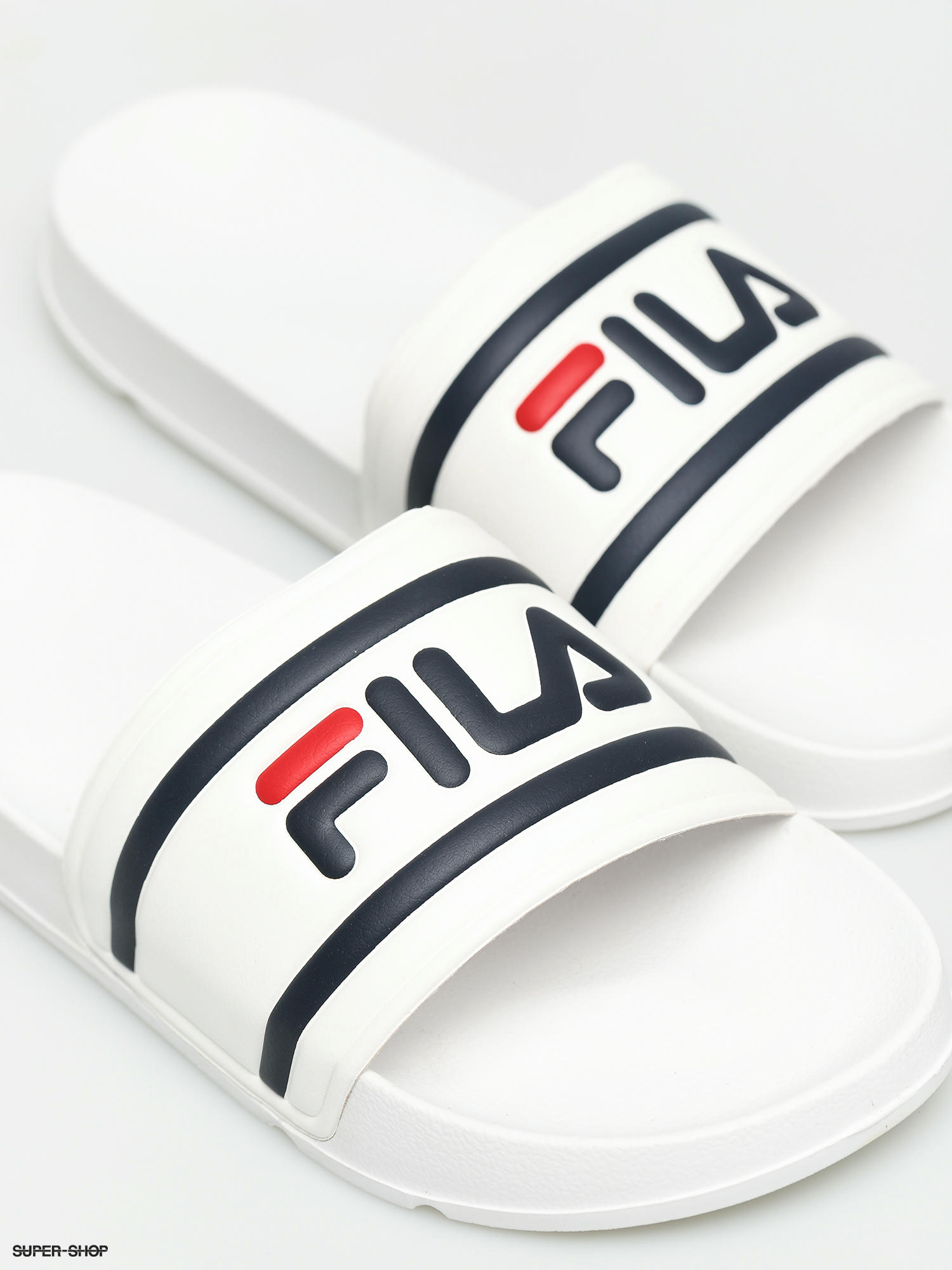 white fila slippers