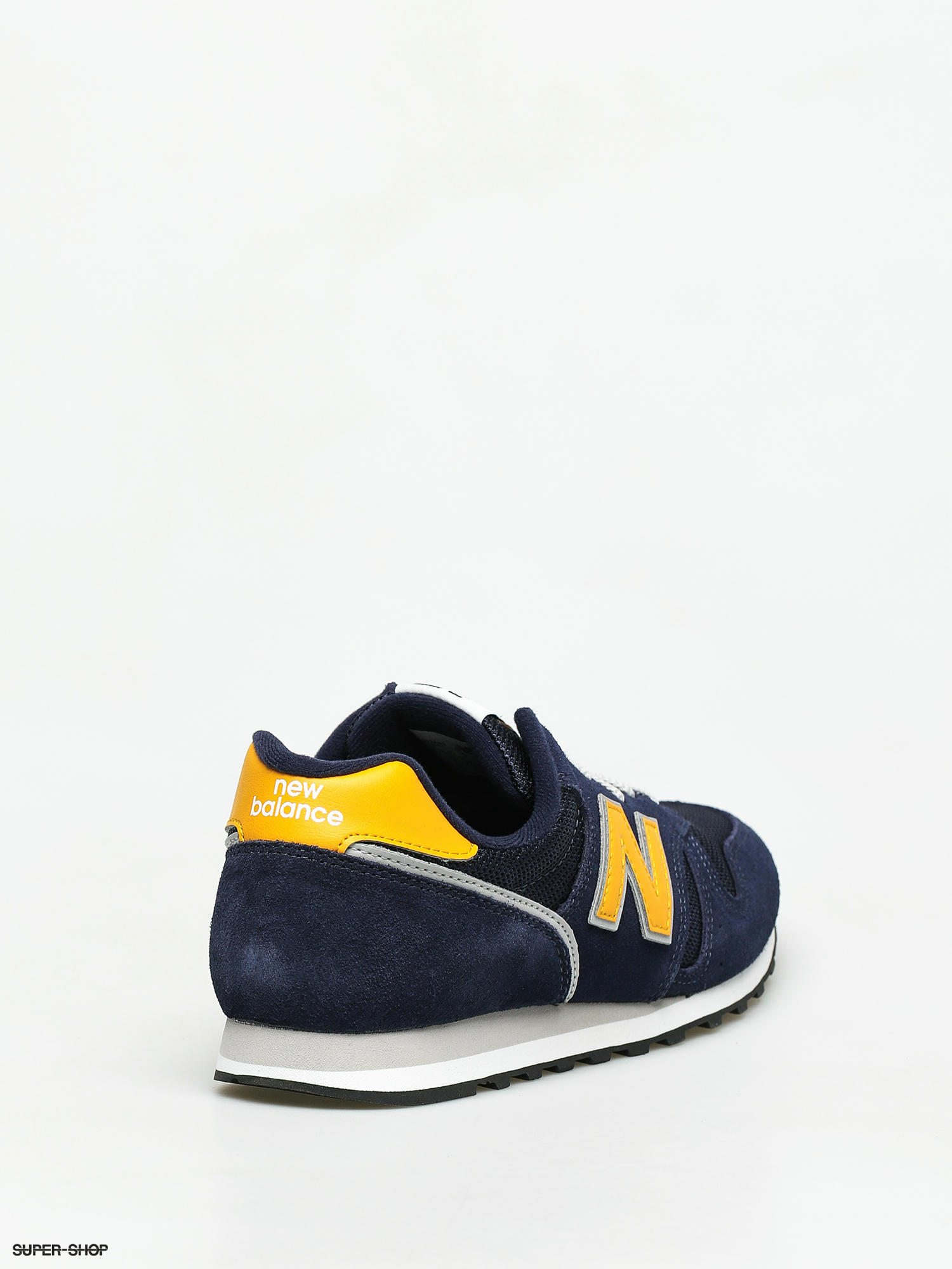 new balance 373 trainers in navy and yellow