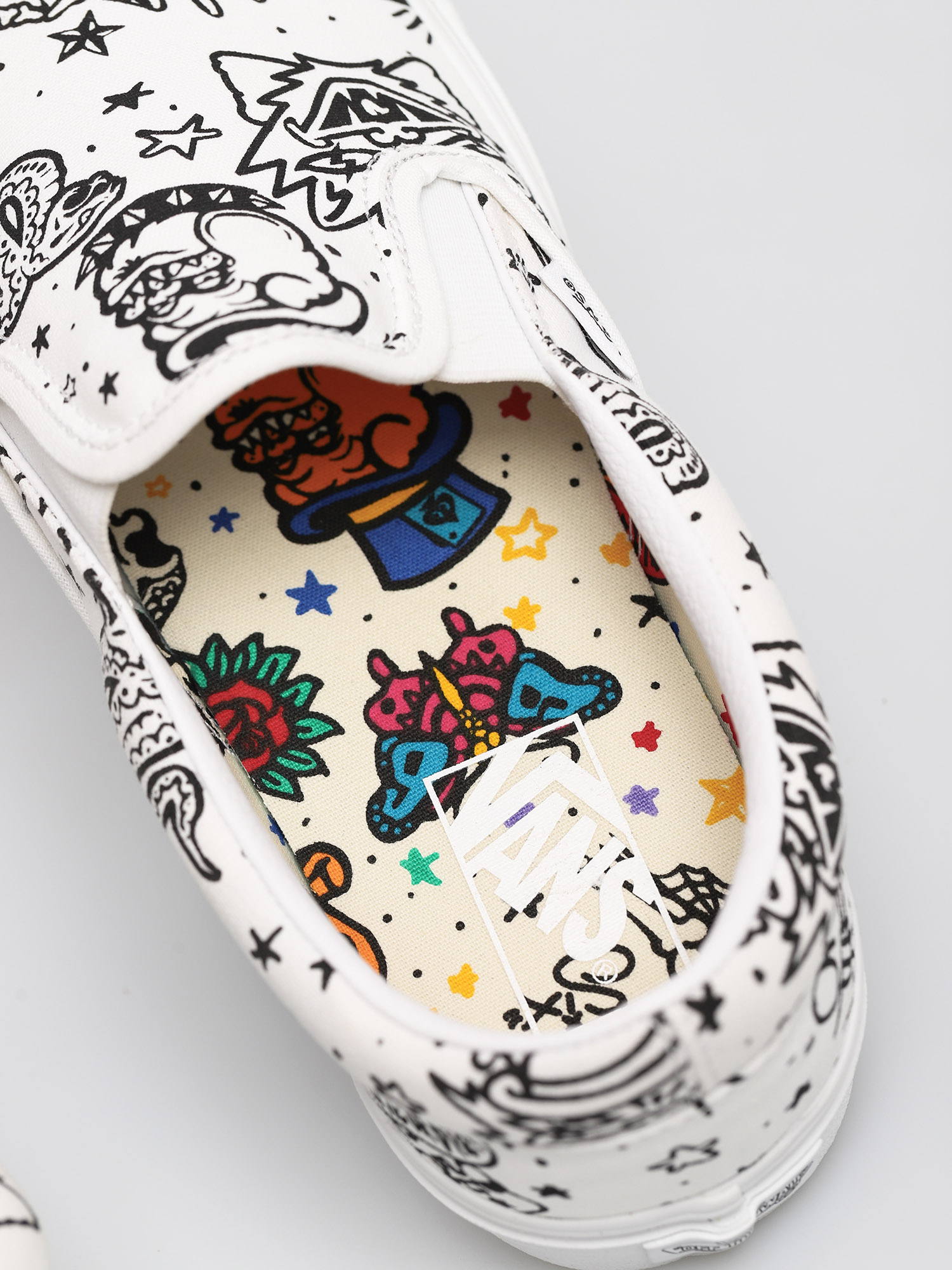 vans tattoo slip ons
