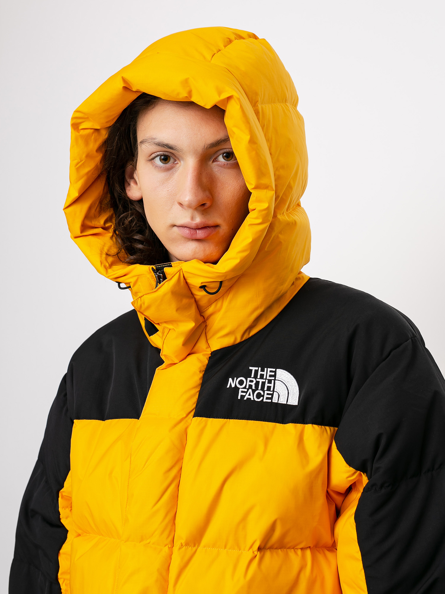 the north face himalayan puffer jacket in yellow