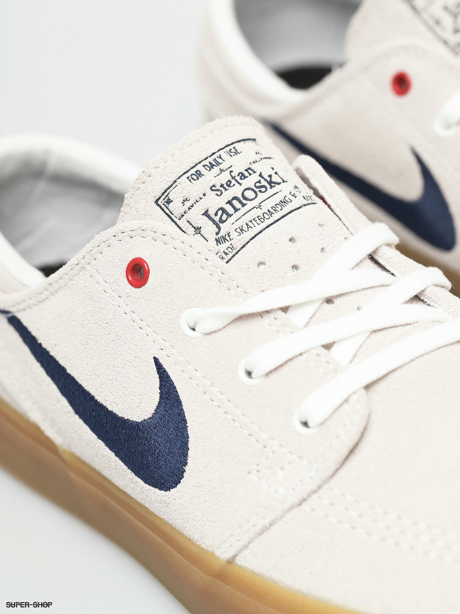 white and navy nike shoes