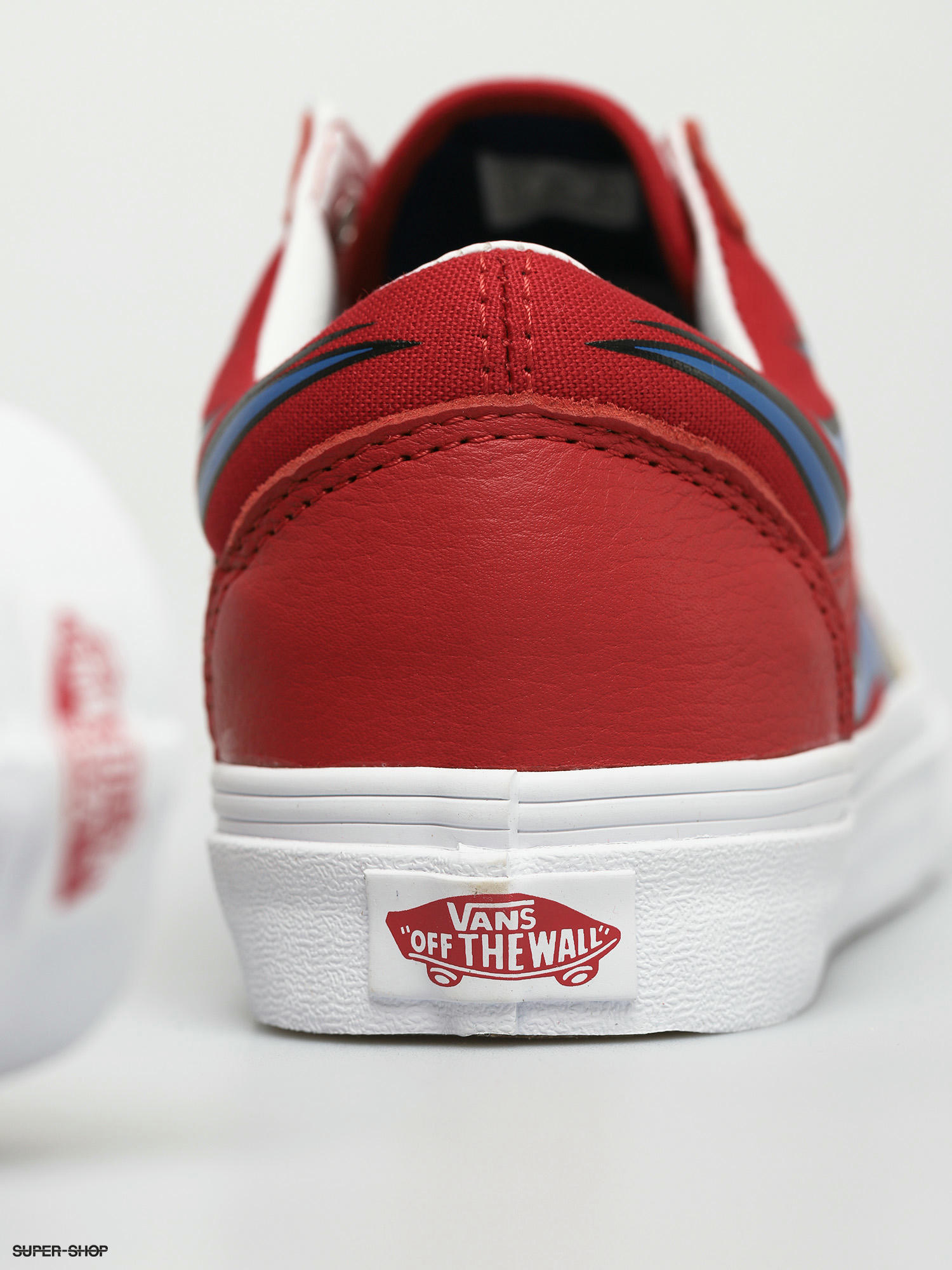 red and blue old skool vans