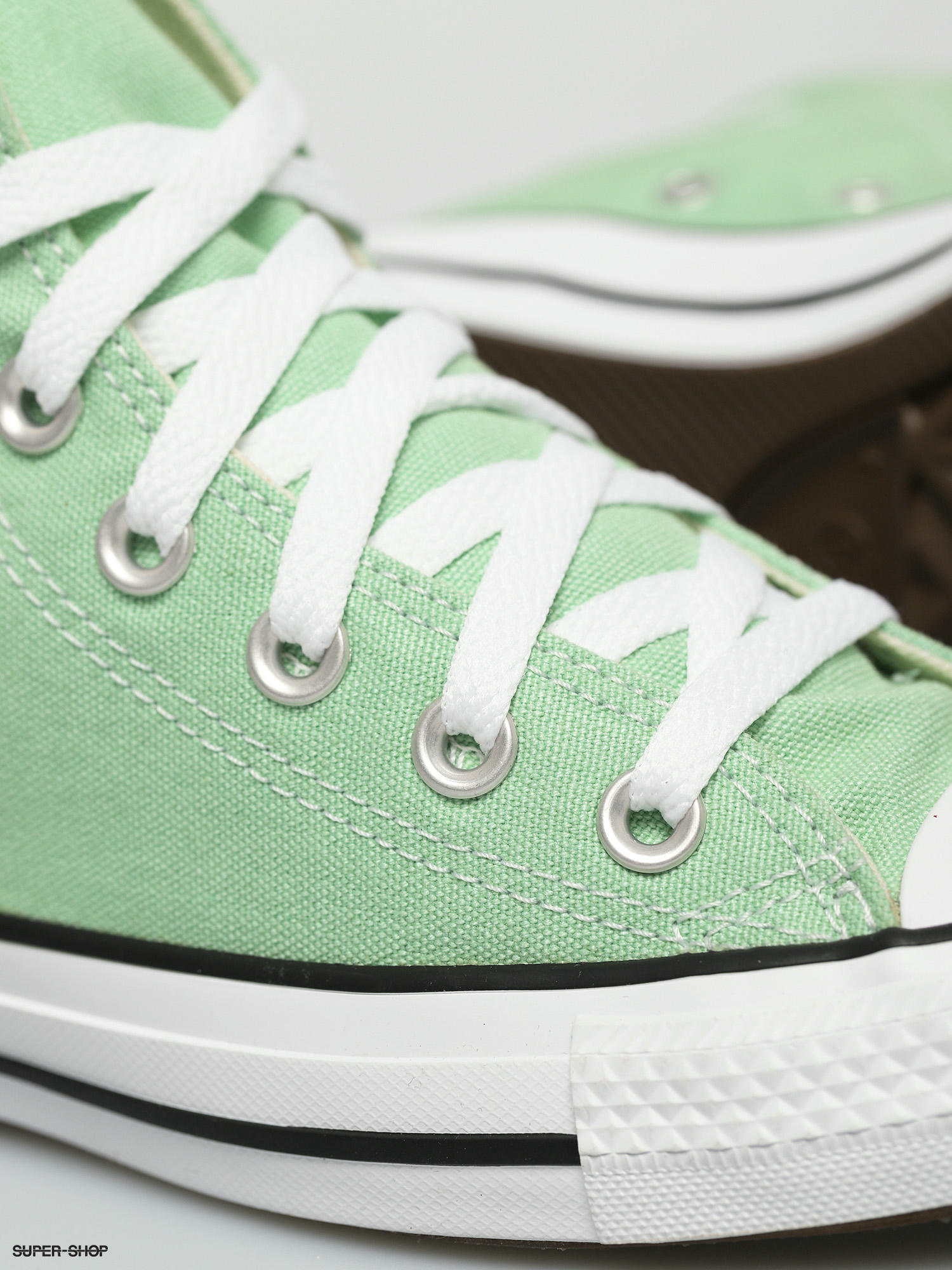 green chuck taylor low tops