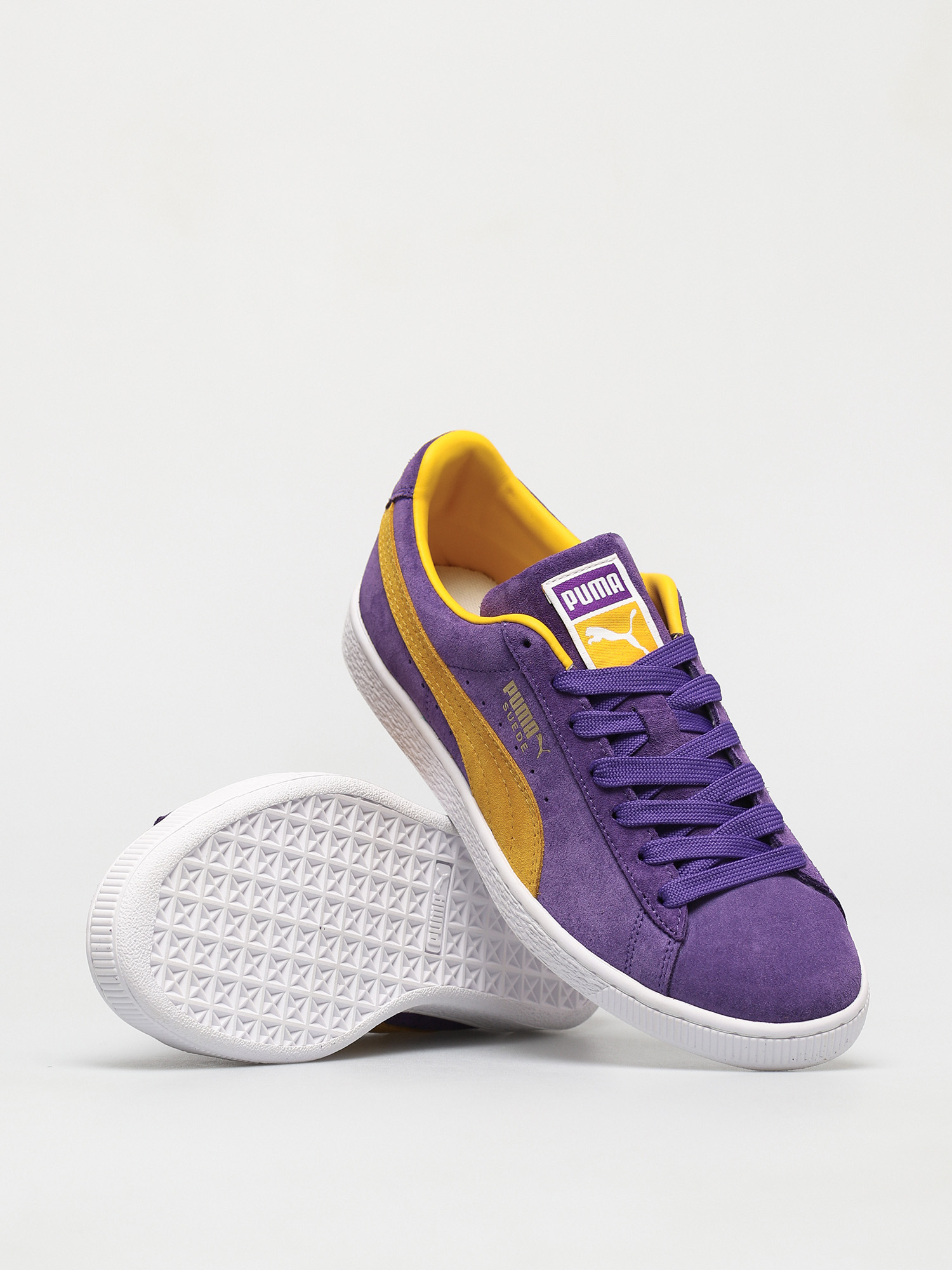 purple and yellow puma suedes