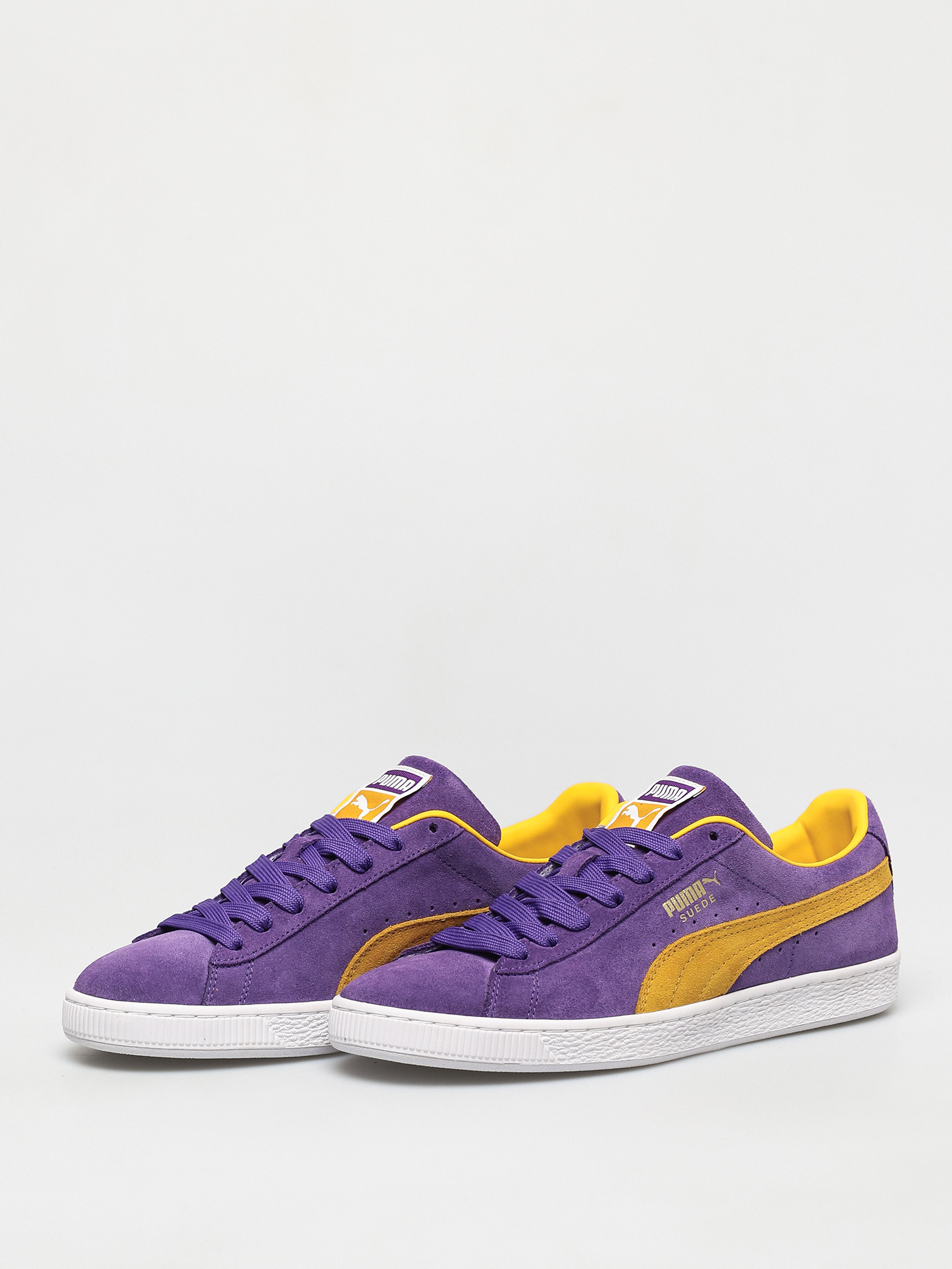 purple and yellow puma suedes