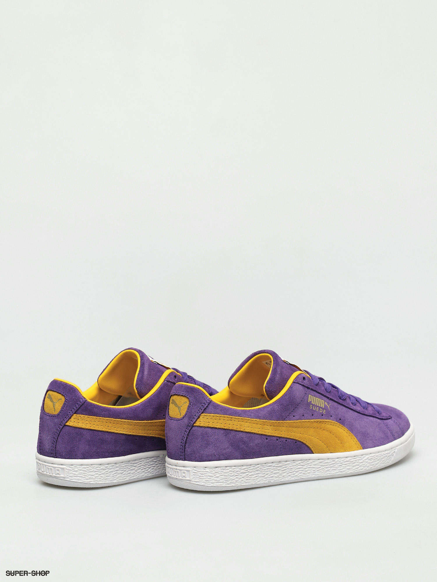 purple and yellow puma shoes