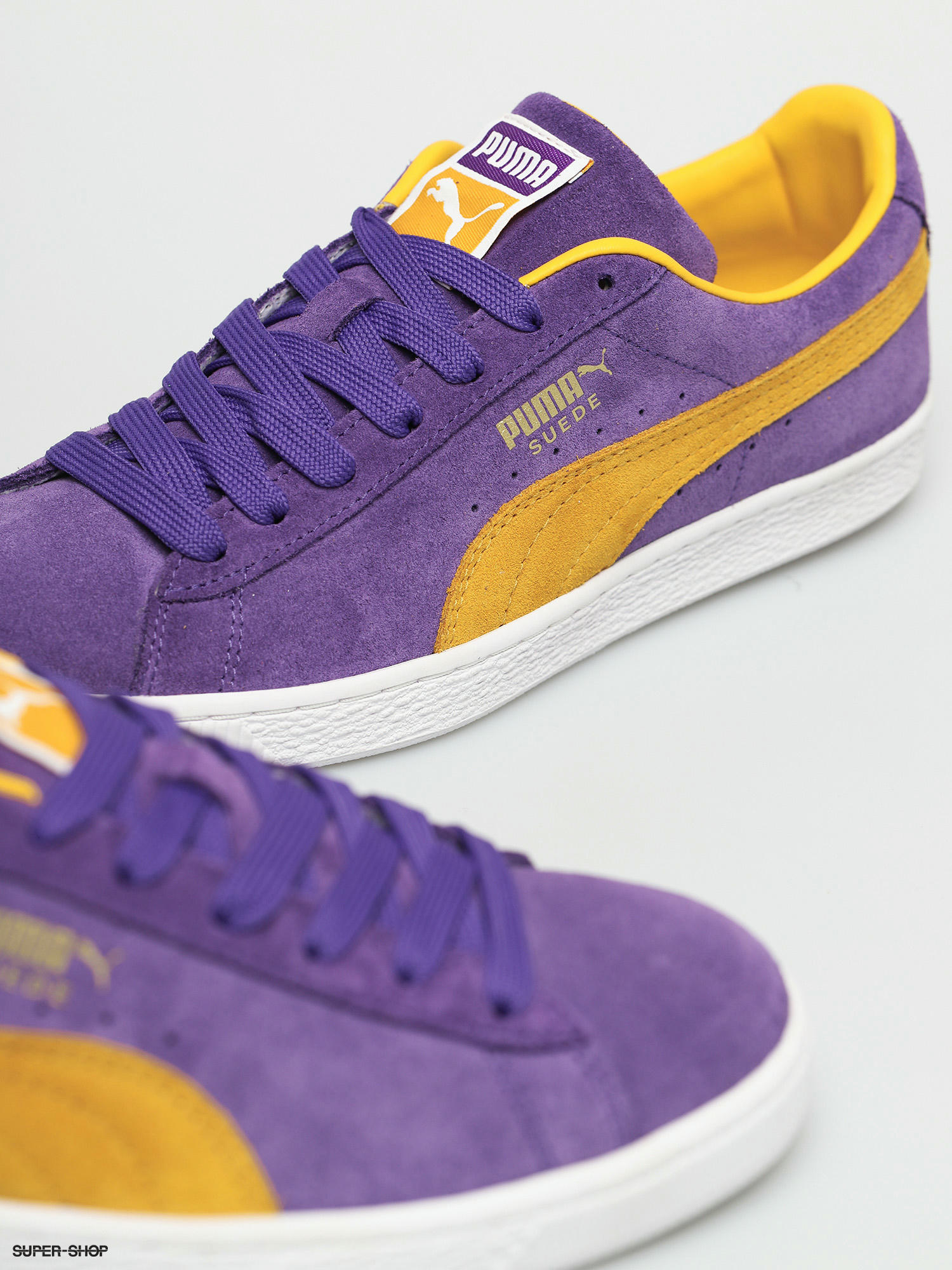 purple and yellow puma shoes