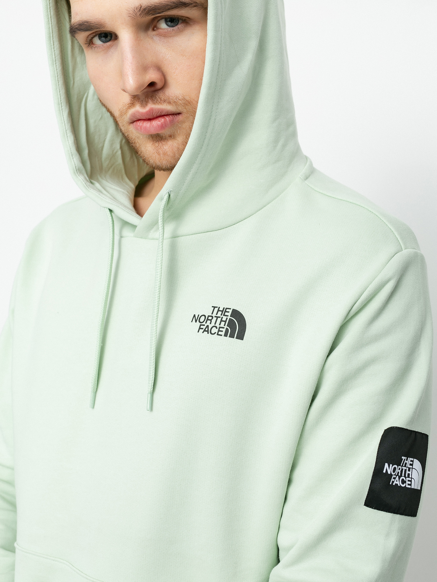 green and black north face hoodie