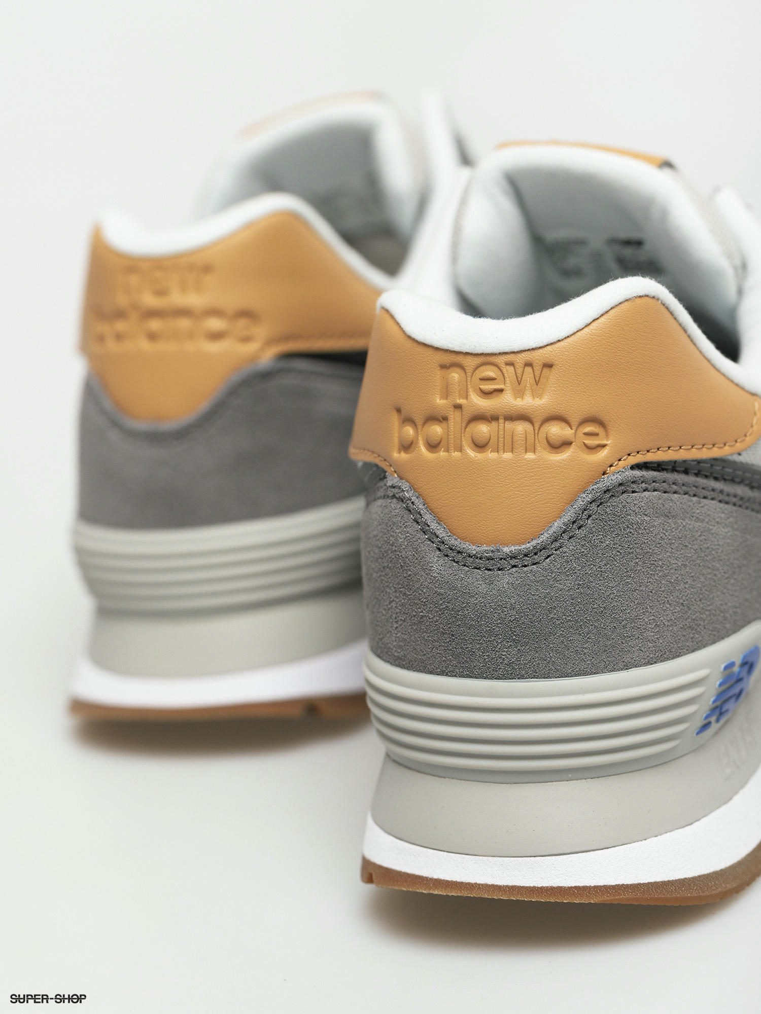 new balance 574 bronze metallic trainers