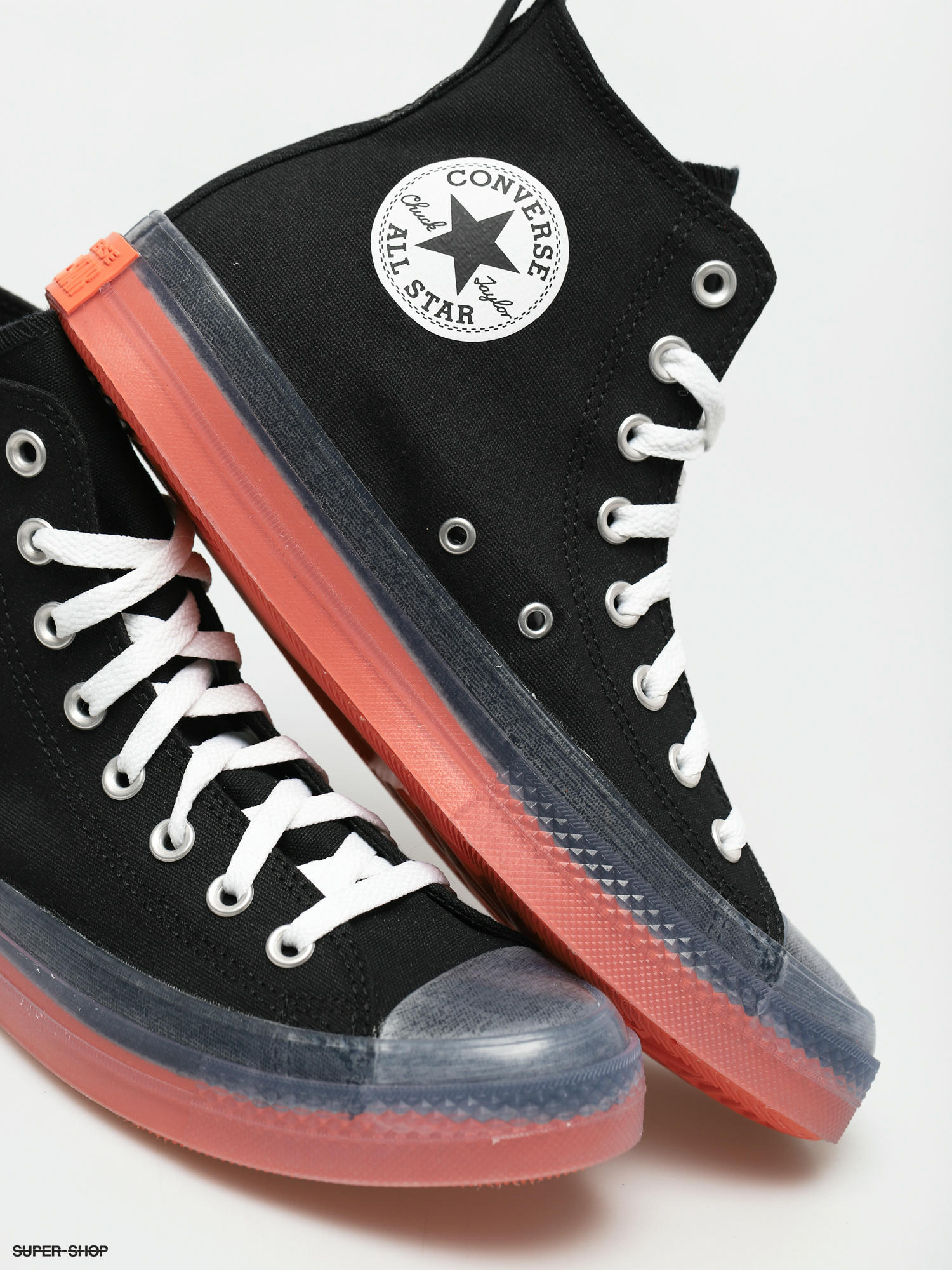 black and orange chuck taylors