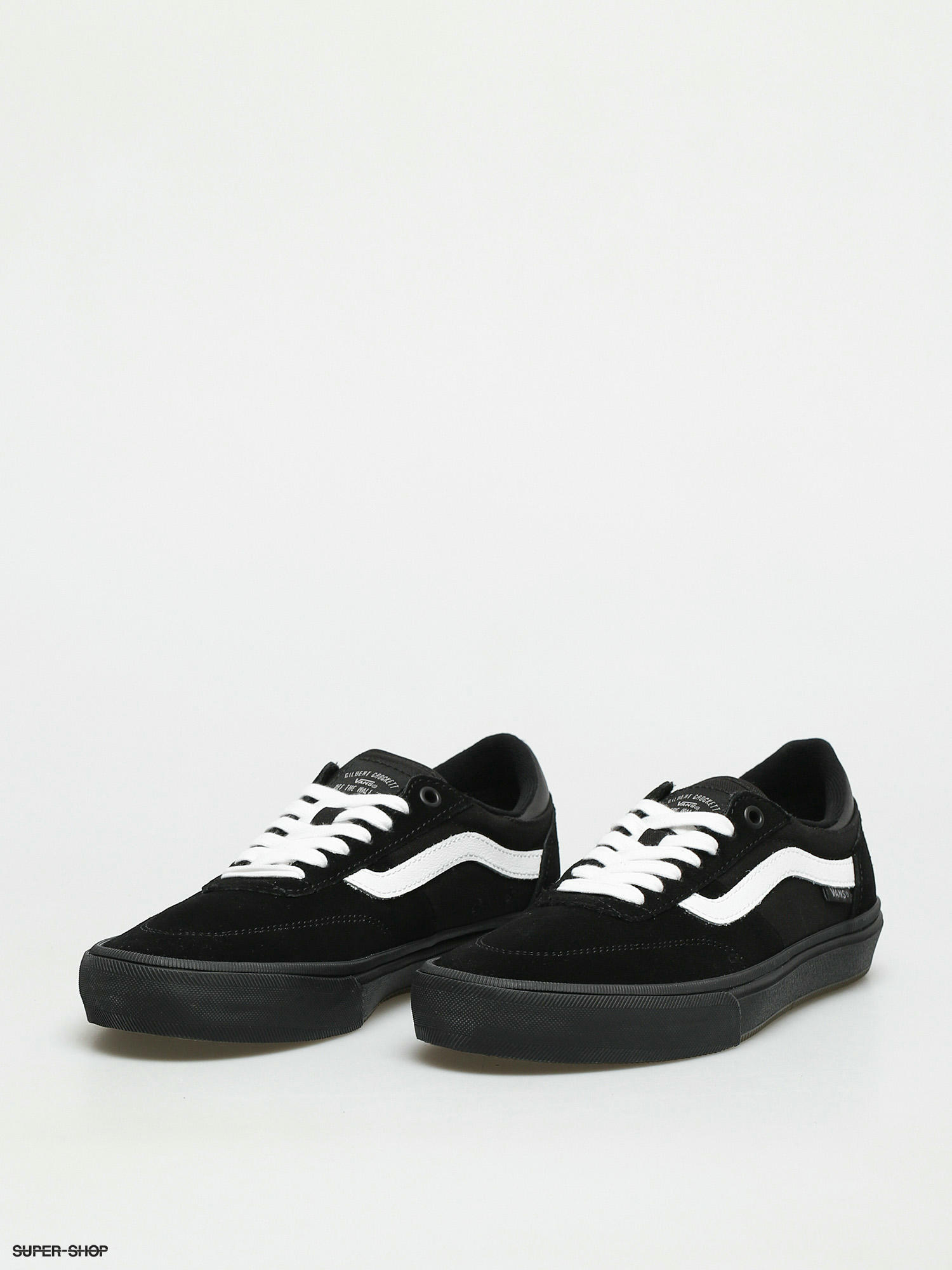 All black store vans white stripe