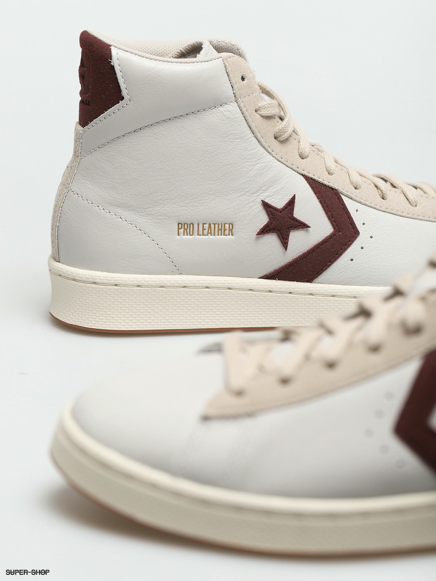 white and burgundy converse