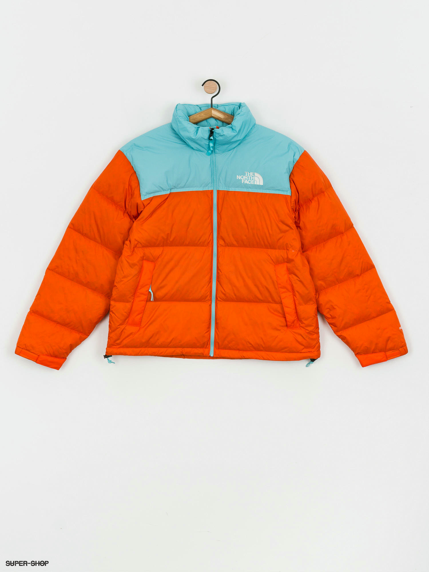 navy and orange north face jacket