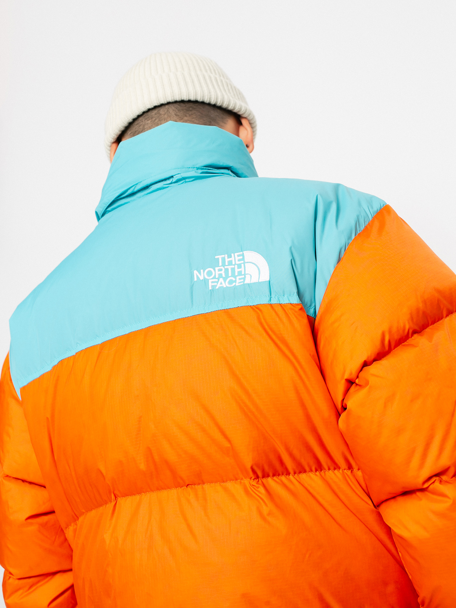 The North Face 1996 Retro Nuptse Jacke (red orange/transantarctic blue)