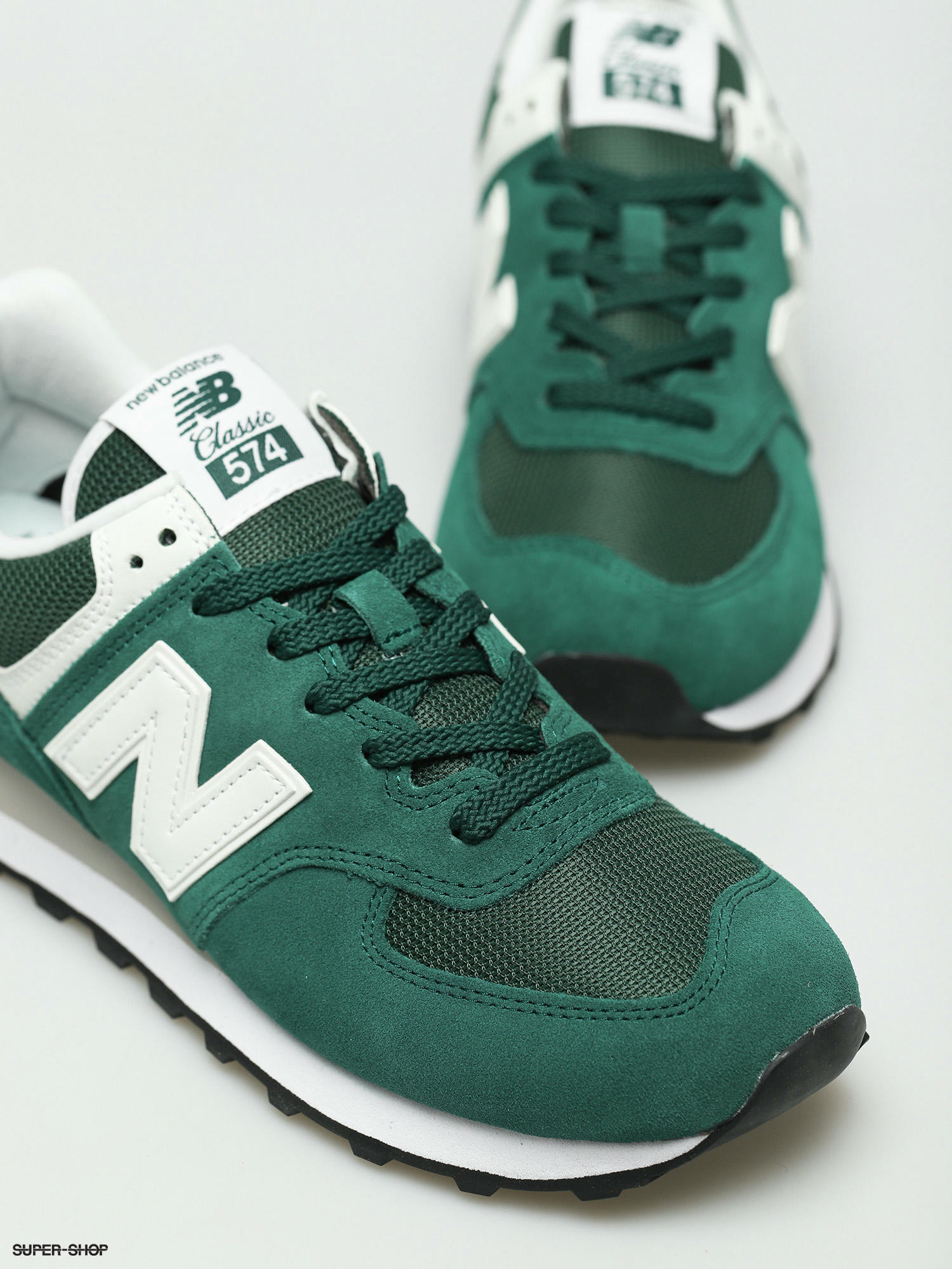 green and white new balance 574