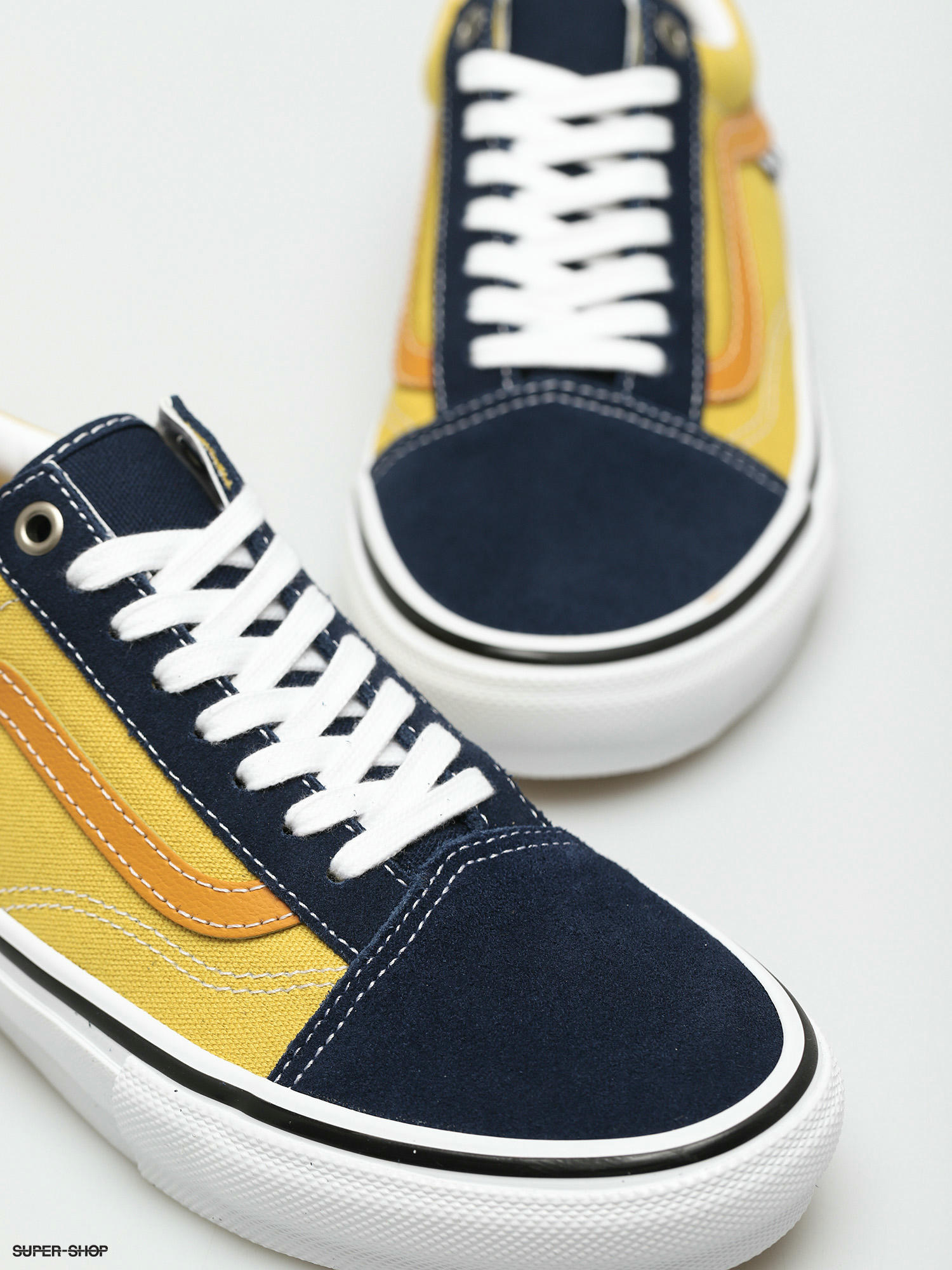 navy and gold vans