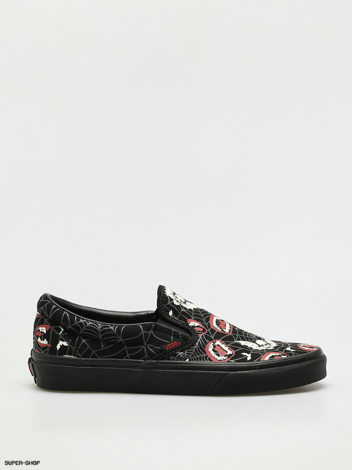 Black slip on vans hotsell with roses