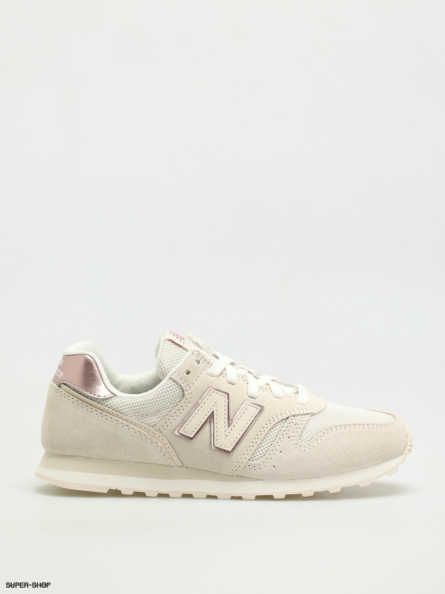 new balance 373 sneakers in cream and gold