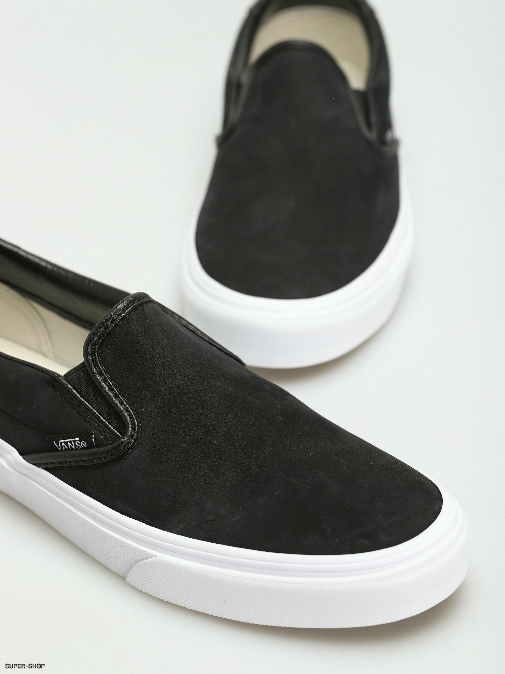 black high top slip on vans