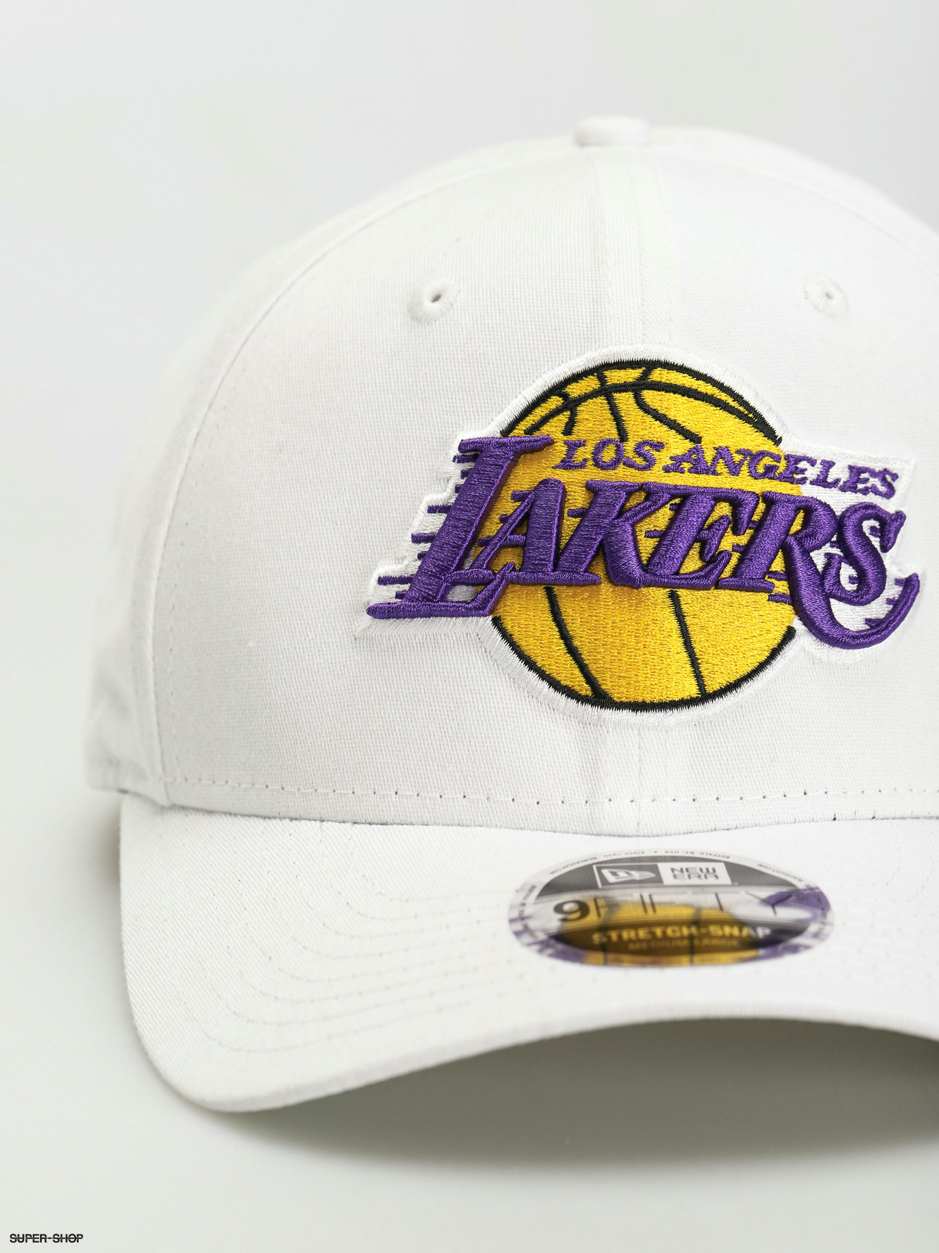 NBA Lakers Metallic Badge Beanie Hat by New Era --> Shop Hats