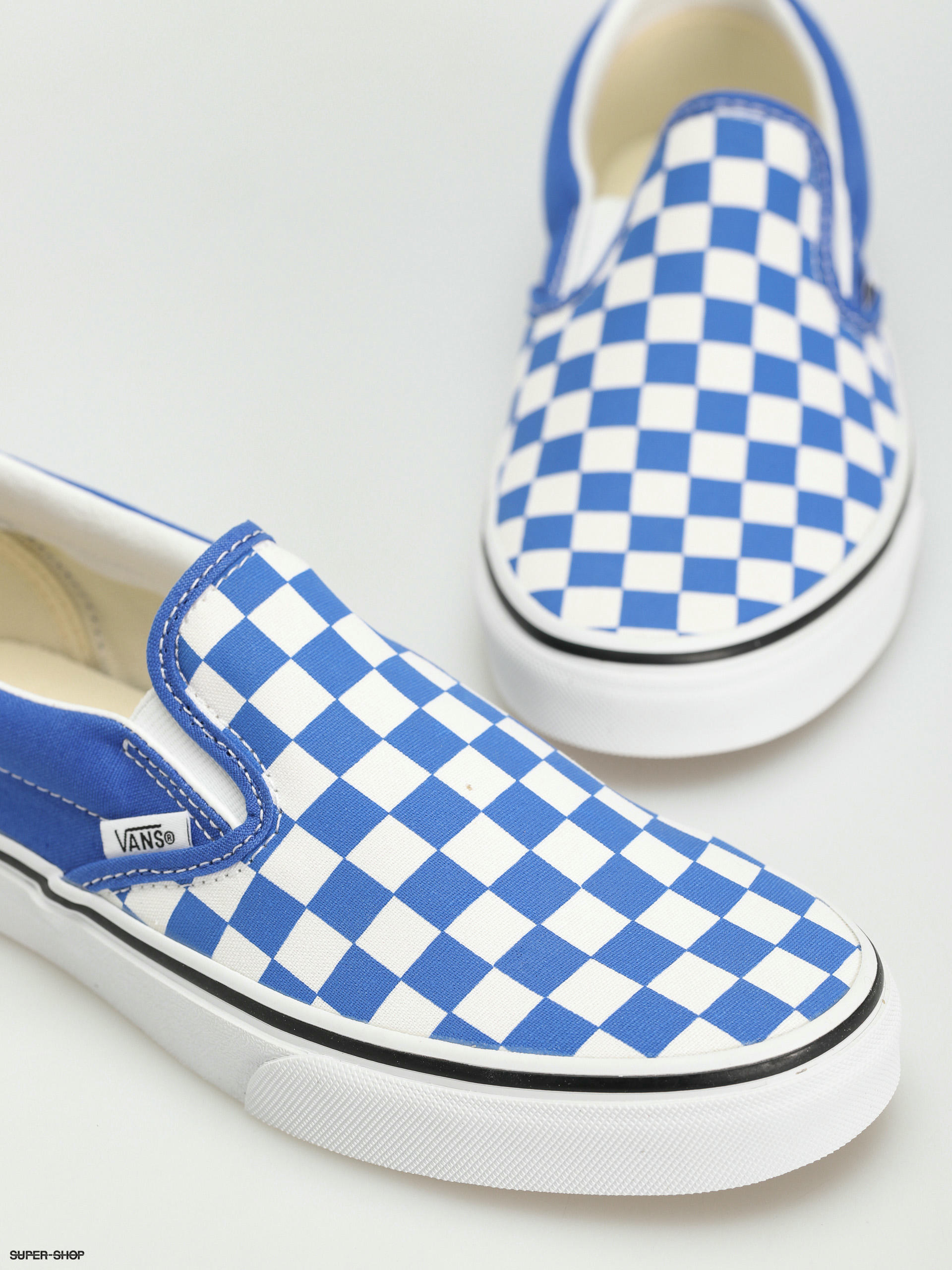 Dark blue checkered store slip on vans