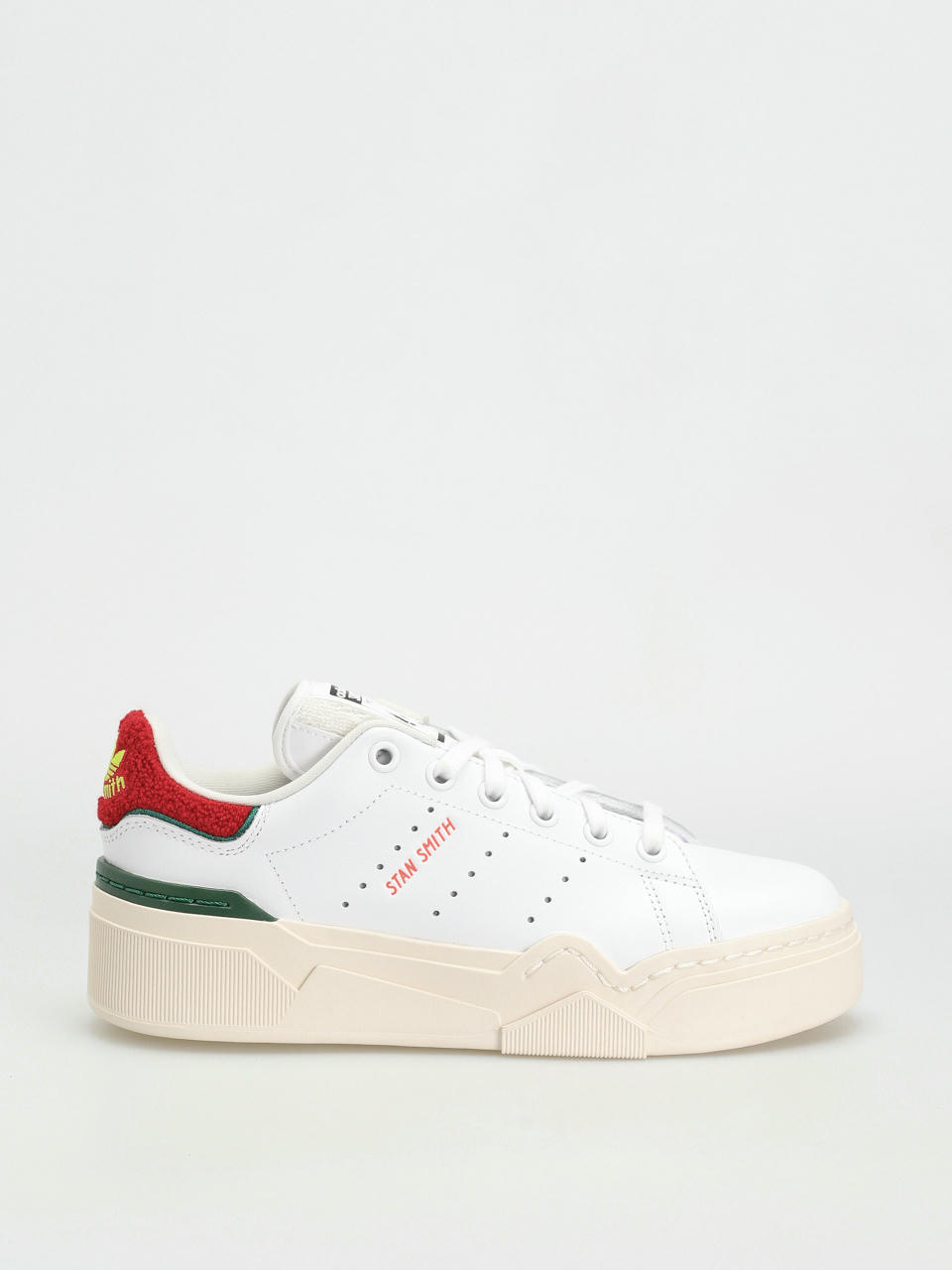 Woman with white and green Adidas Stan Smith shoes and Gucci socks