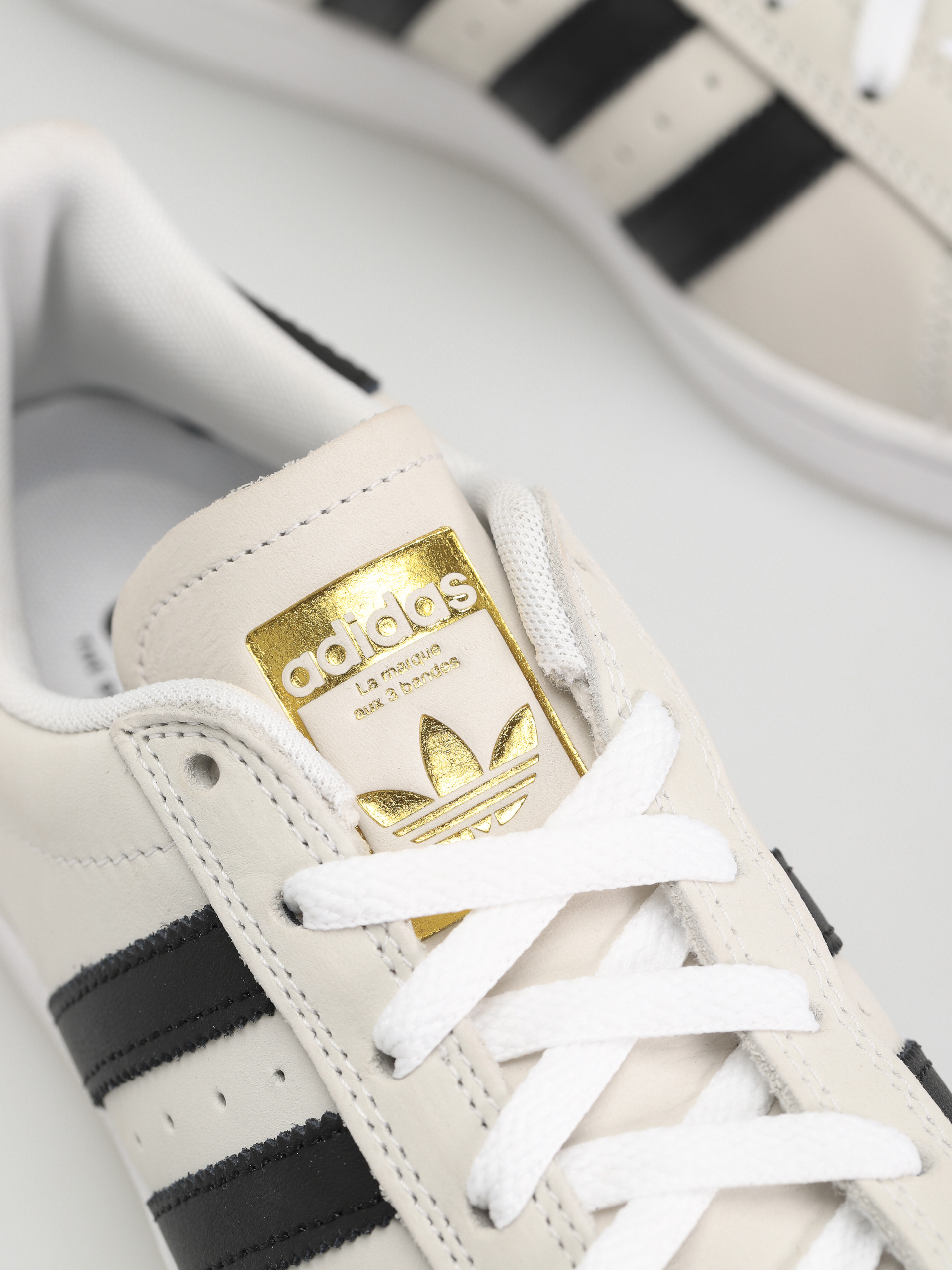 Adidas superstar hotsell with gold tongue