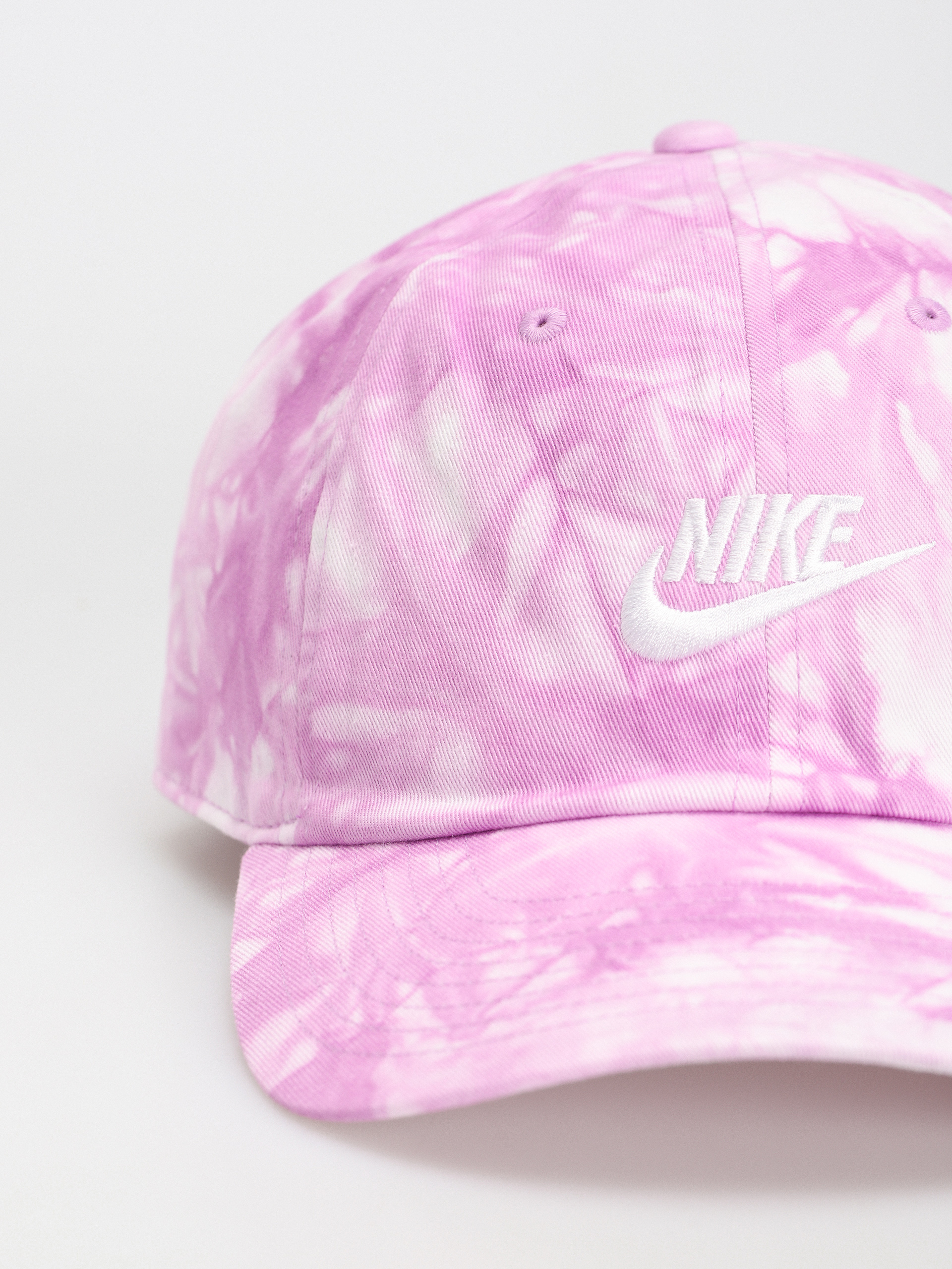 white and pink nike hat