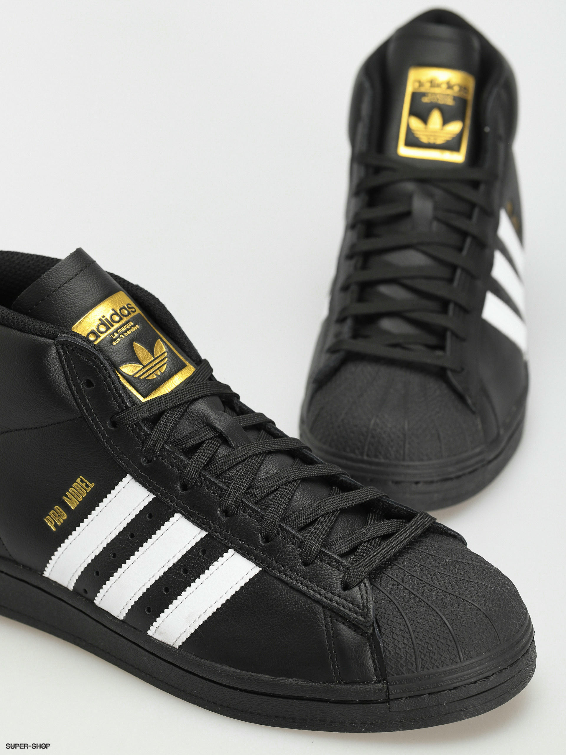 Adidas pro model black hotsell and gold