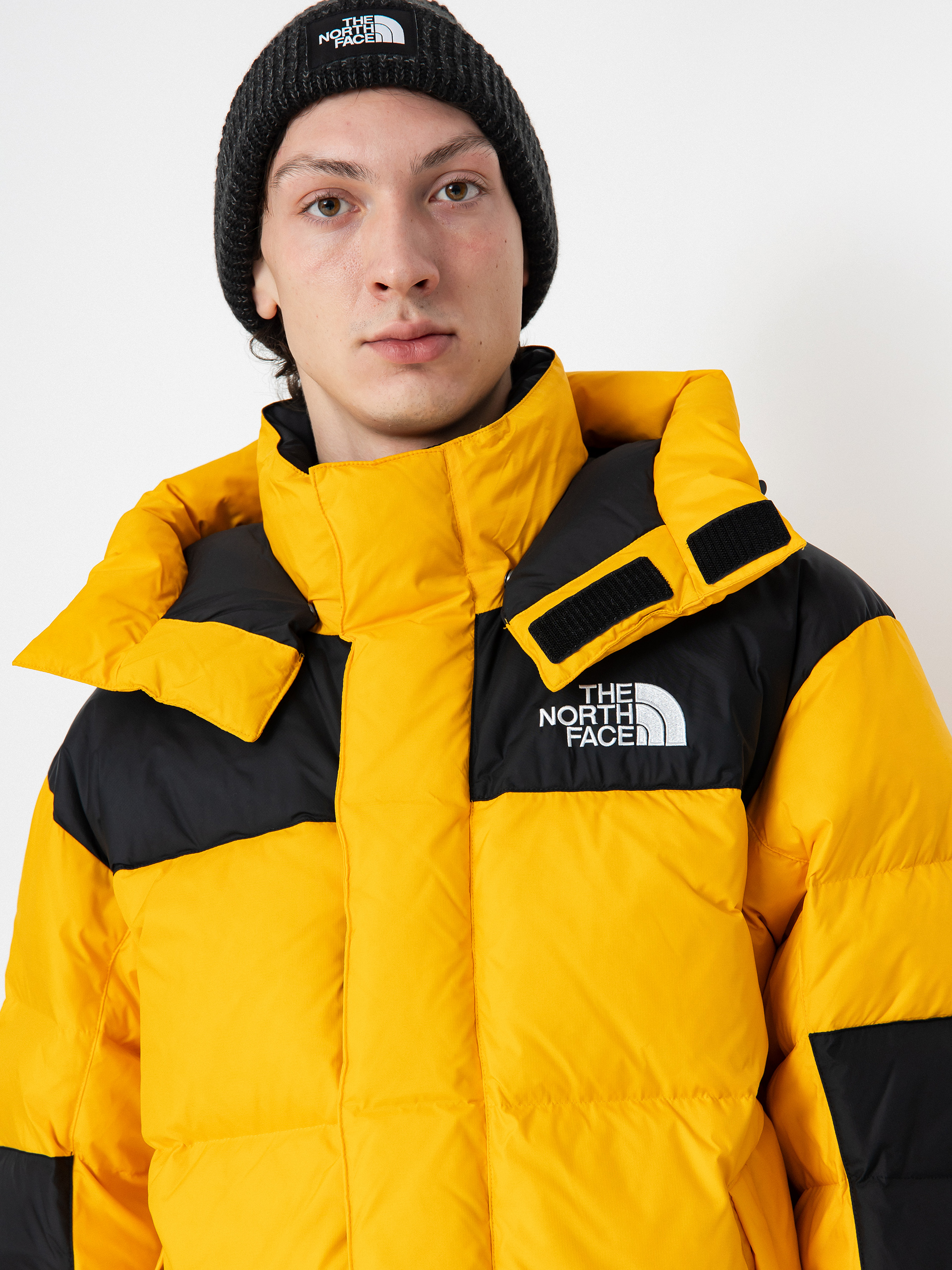 The North Face Hmlyn Baltoro Jacke summit gold tnf black n