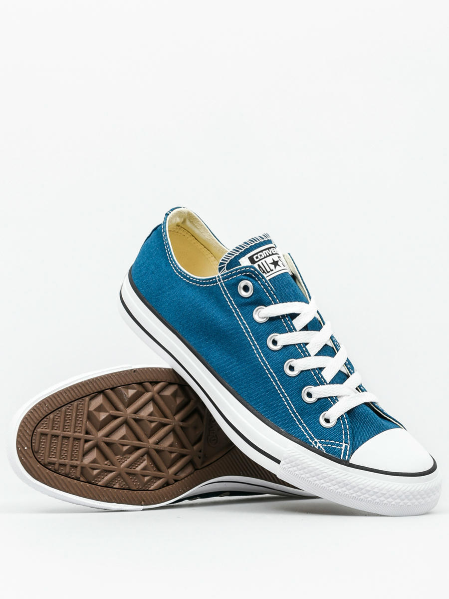 company that manufactures chuck taylor sneakers codycross
