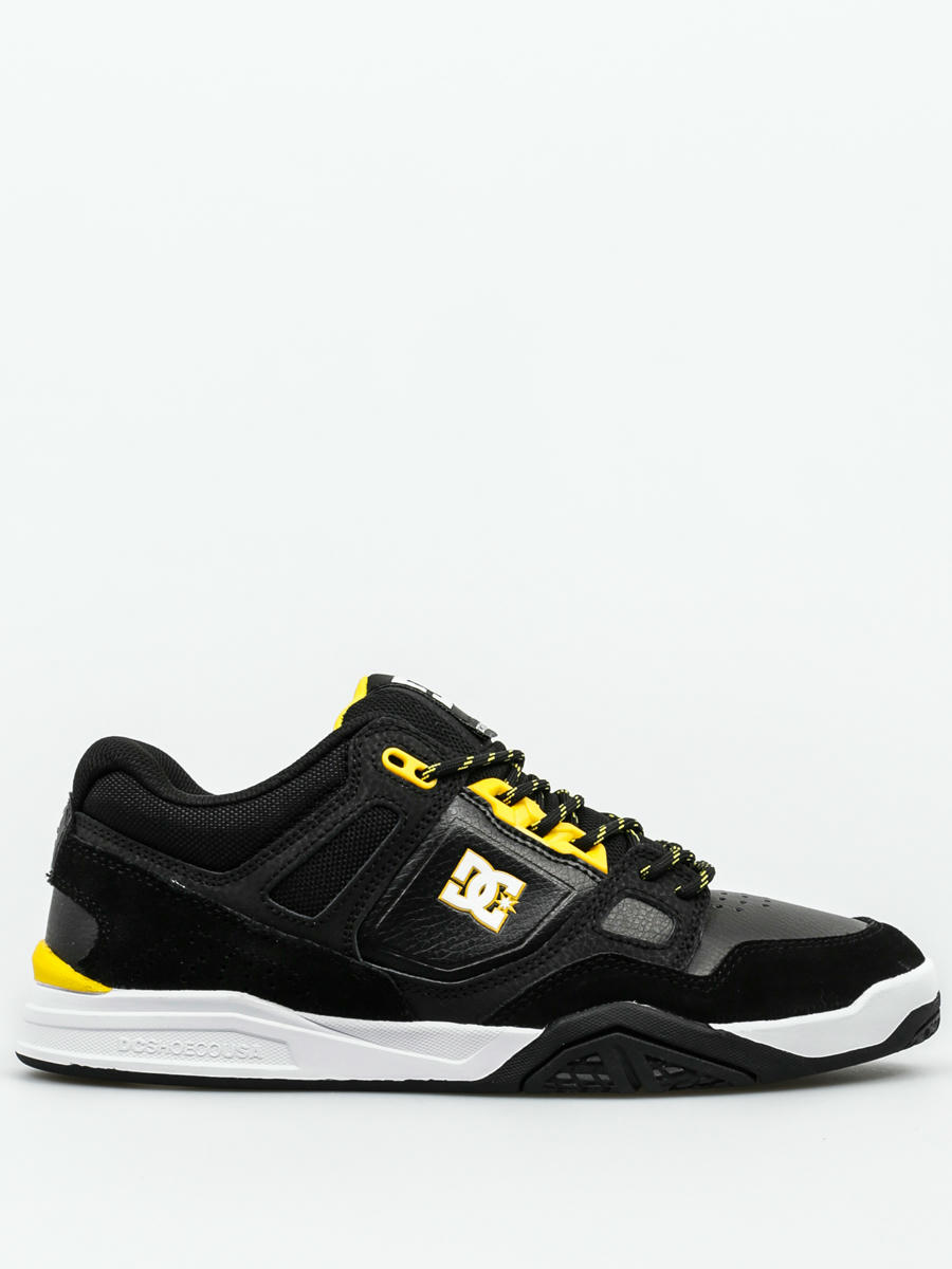 black and yellow dc shoes