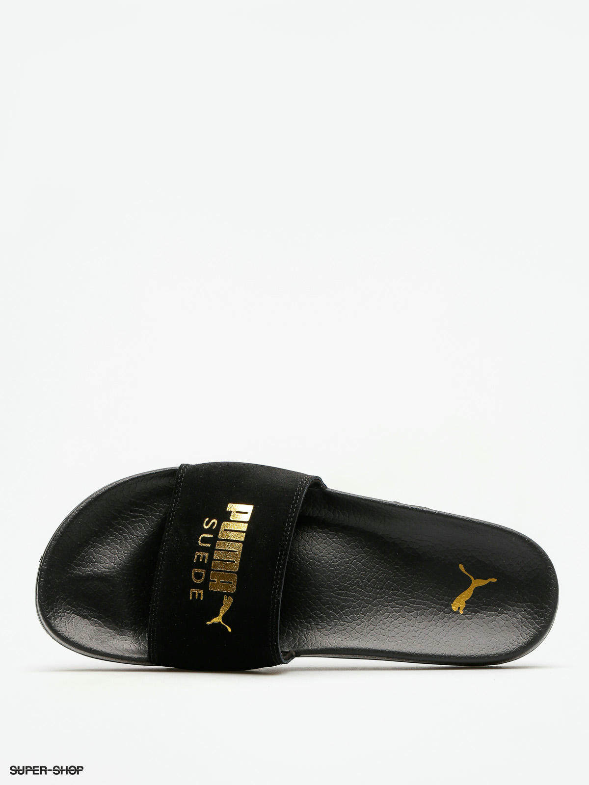 gold and black puma slides